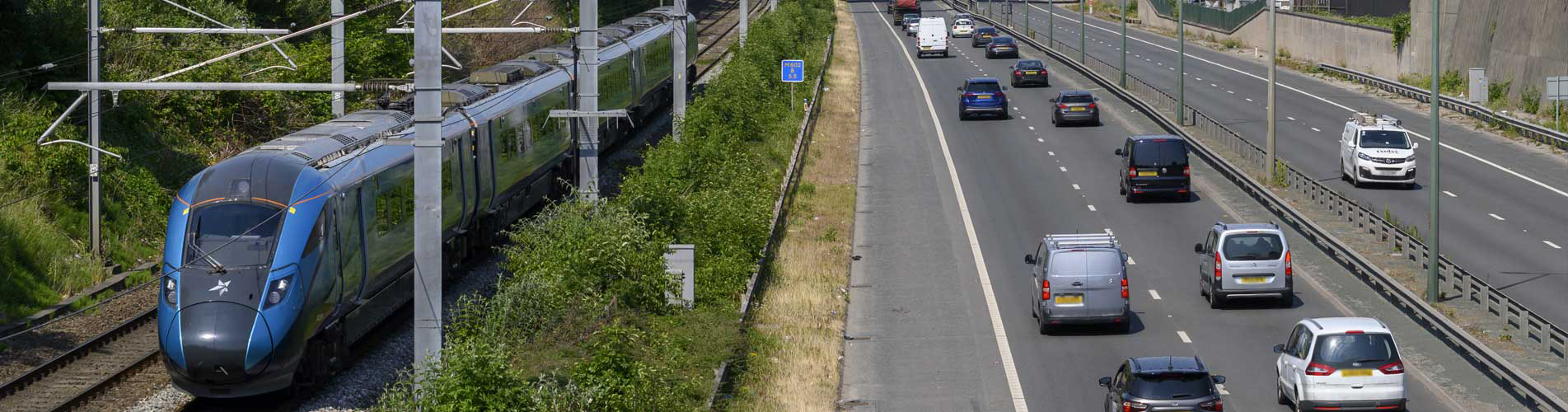 Railway beside a road