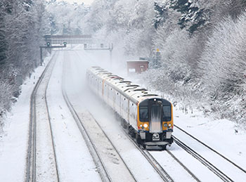 Train on track in the snow