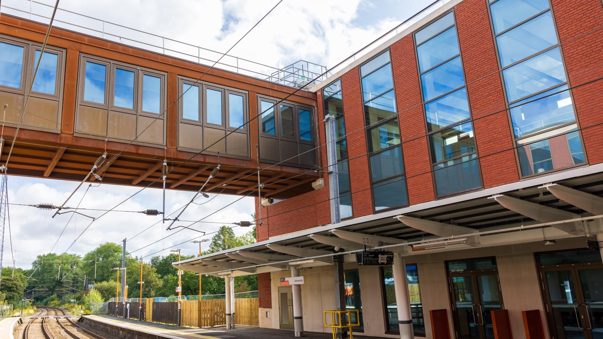 Photo of the rail link bridge and new station building at University station